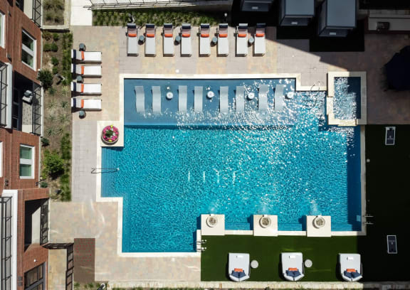 Swimming Pool With Lounge Chairs at Berkshire Pullman, Frisco, Texas